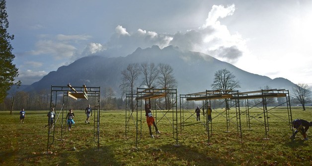 Entrants in the 2012 Winter Pineapple Classic benefit run move through the obstacle course at Mountain Meadows Farm.