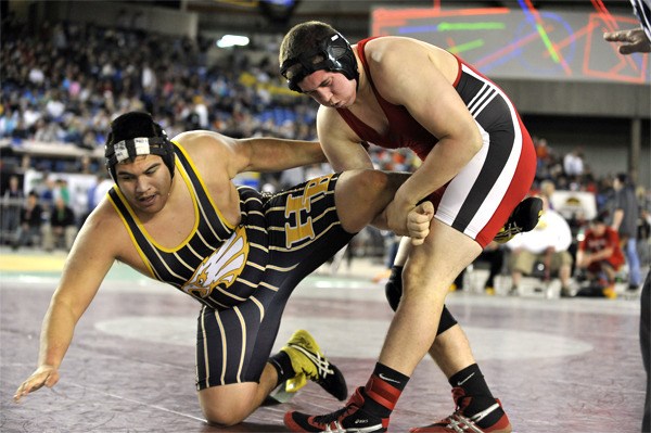 Mount Si's Josh Mitchell grapples Hudson's Bay wrestler Tyler Rangel during Mat Classic XXIII competition Saturday