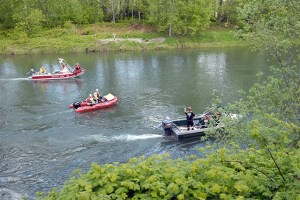 Three search boats comb the Snoqualmie River near Fall City