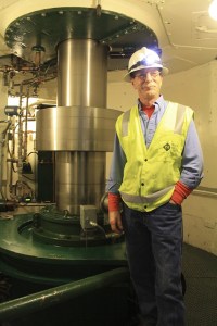 The original turbine spins again behind Plant Operator Byron Kurtz