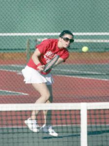Marianna Zanella returns a serve in action against Skyline last week. Zanella lost a close match 6-3