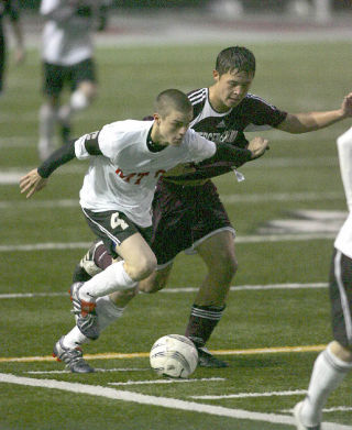 Kevin Isackson works around a Mercer Island defender in last week’s 5-0 loss. Mount Si had another tough contest later in the week