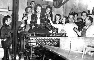 The crew gathers to help Snoqualmie Valley Record Publisher Charlotte Paul Groshell celebrate the publication of her first book