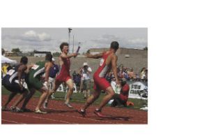 Owen Strom hands off to Frank McLaughlin in the last leg of the 4-by-400 relay last Saturday