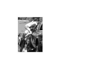 Mount Si cheerleader Chloe Villanueva climbs on the shoulder of Brittany Hake to make sure a truck gets clean