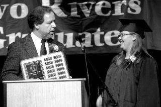 Two Rivers Principal Tom Athanases presents Rachel Wyss with the Rotary Club’s annual student award. Wyss