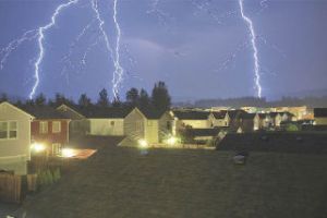 Lightning cascades around the Snoqualmie Ridge retail marketplace in this photo