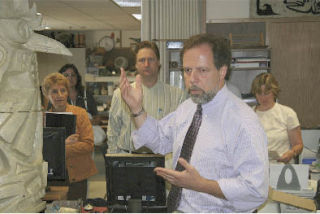 Two Rivers Principal Tom Athaneses leads a tour of his school