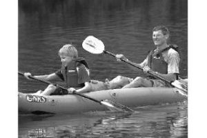 Kayakers paddle on Rattlesnake Lake during last year’s TrailsFest event