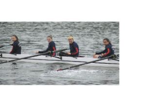 North Bend athletes Sarah Williams and Andrea Volken row with their Sammamish Rowing Association teammates on their boat. Williams is second from left