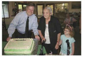 North Bend Councilman David Cook and his daughter Jillian help Betty Vaughan celebrate her Lifetime Achievement Award at a July 15 reception. Perhaps best known for donating knitted items