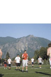 Mount Si High School grad Michael Smart works out with Valley high school students on Tuesday