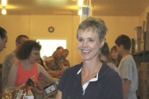 Gail Gergasko pauses for a moment in the midst of Wednesday’s weekly food distribution at the Mount Si Helping Hand Food Bank. She plans to continue her volunteer work through special food bank projects.