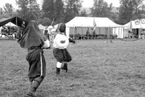 Craig Robertson of Lacey blocks with his buckler as he duels Ramond Mendez of Everett on Saturday