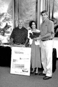Snoqualmie Mayor Matt Larson picks up a plaque and kudos from  Kathleen Davis