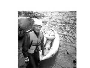 Pulling his inflatable craft out of the Middle Fork of the Snoqualmie River