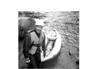 Pulling his inflatable craft out of the Middle Fork of the Snoqualmie River