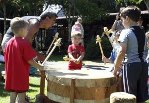 Snoqualmie tribal carver and drummer John Mullen shows a group of children how it’s done at the Arts at the Depot event at Railroad Days. Mullen is among a big group of returning artists.