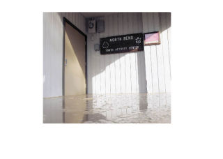 Sewage inside the Snoqualmie Valley Youth Activity Center in North Bend was several inches deep after a sewage treatment plant overflowed last spring. The building still hasn’t been cleaned up.