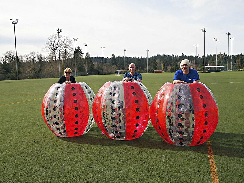 Courtesy PhotoTJ Sports owners Toni and Michael Gagner with their son Nick. TJ Sports will be running the Knockerball events at the Carnation fourth of July celebration.