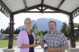 Sharing a laugh and showing off goodies to be had at the upcoming North Bend Farmer’s Market