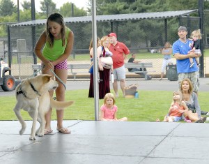 File PhotoA crowd gathers to watch pets and their owners showcase their tricks and costumes at the community stage.