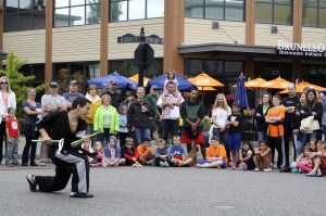A crowd gathers to watch the DMW Martial Arts weapons demonstration at the 2015 block party.Evan Pappas/File Photo
