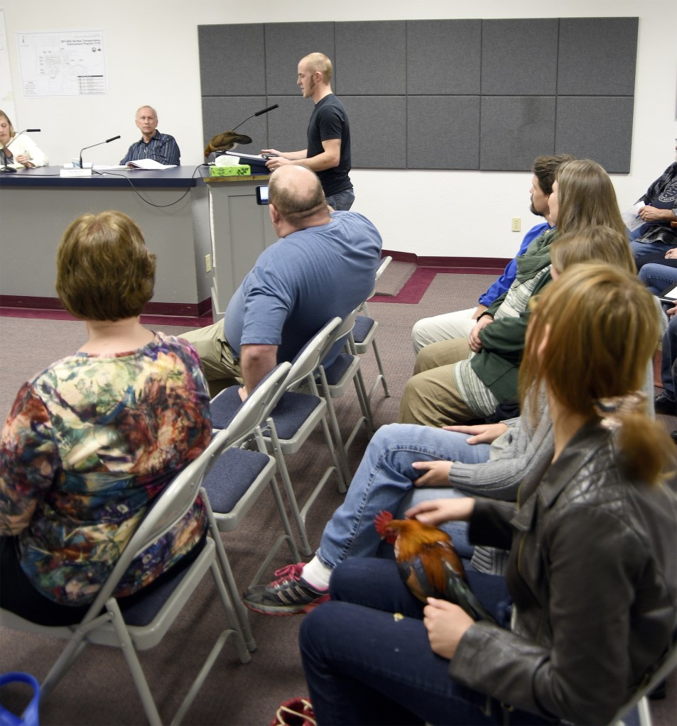 Juliane Luna and two of her chickens joined about a dozen people at the Carnation City Council meeting Tuesday