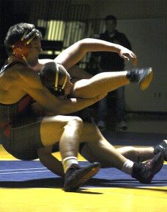 Mount Si wrestler Cameron McLain brings down his Bellevue opponent