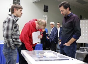 North Bend council members Trevor Kostanich and Brenden Elwood discuss their thoughts on the Lawhead architects city hall concept after Frank Lawhead’s presentation.