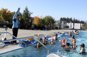 Evan Pappas/Staff PhotoAssistant Coach Carly Petrzelka gives some of the swimmers tips on their technique.