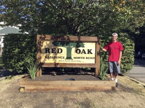 Evan Pappas/Staff PhotoStone stands with his completed and installed sign on Sept. 11