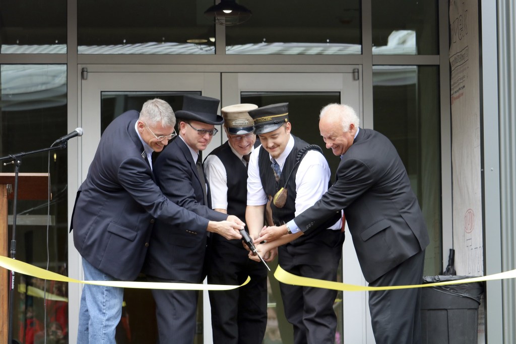 Evan Pappas/Staff PhotoOrganization representatives officially cut the ribbon on the Railway Education Center. From left