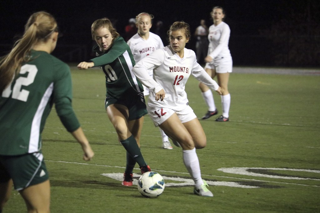 Evan Pappas/Staff PhotoMount Si Captain Natalie Weidenbach challenges a Skyline player for possession in the first half.