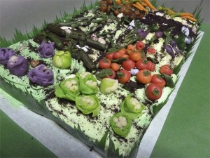 Laurie Clark's artistic efforts in creating a candy garden patch on top of an apple spice cake earned her a blue ribbon in the Pomona Baking Contest.