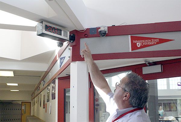 Bill Davis points out the new security cameras and alert systems installed just outside the main office of the Mount Si High School Freshman Campus.