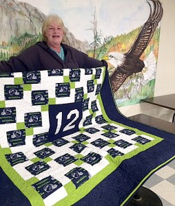 Carmon Moe of North Bend with her 12th Man Quilt.
