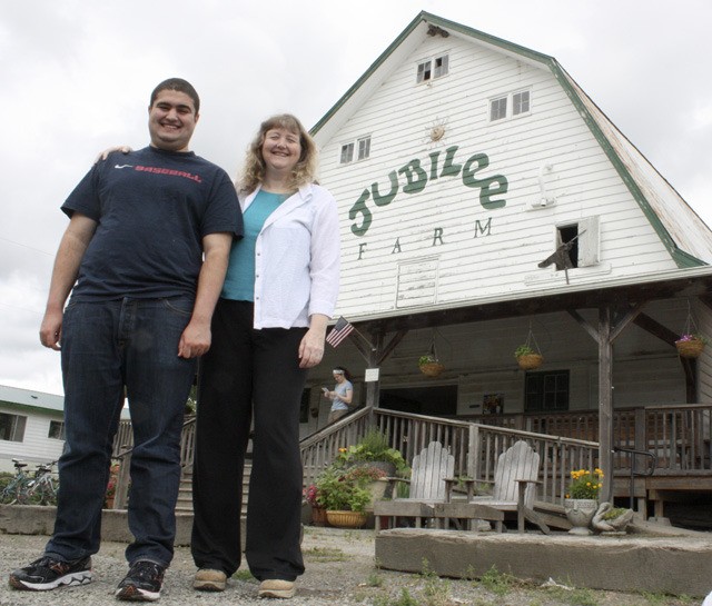 Caspian and Lynne Banki stand outside the Jubilee Farm barn where the 12th annual Autism Day WA will take place