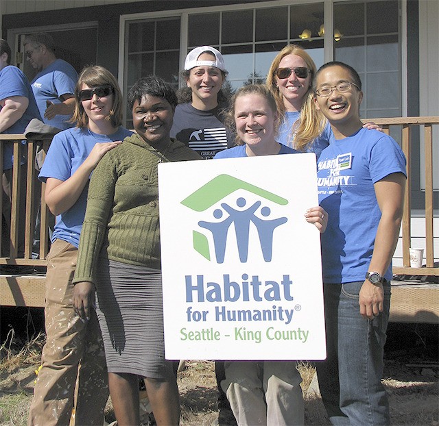 Celebrating with Sunday Dador at her new home are Americorps volunteers. Pictured from left are Angela Galli