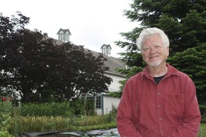 The 100-year-old Hjertoos barn overlooks the community garden that owner Roger Thorson created seven years ago. Thorson