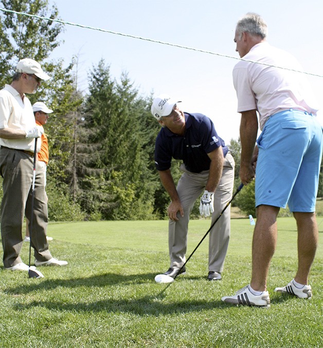 Golf pro Blaine McCallister shares knowledge of the game with amateur players in the Korean Air Pro Am Thursday