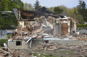 One of five homes on Bendigo Boulevard are scrapped in demolition last week