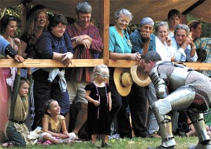 A youngster chats it up with one of Camlann Village’s knights during last year’s summer festival celebration. This year