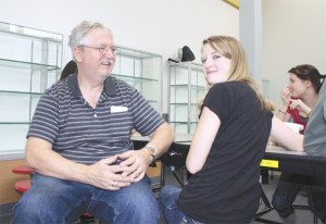 Danny Raphael and his daughter Alexandra eat lunch in the Mount Si High School commons during Parent Visitation Day.