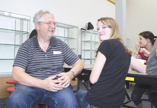 Danny Raphael and his daughter Alexandra eat lunch in the Mount Si High School commons during Parent Visitation Day.