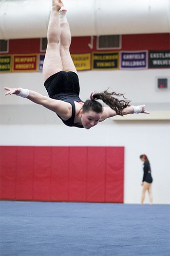 Jenn Rogers warms up for a meet in 2014.