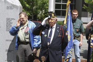A Memorial Day scene at Snoqualmie: Veterans Lloyd Peterson and Lee Scheeler salute the flag
