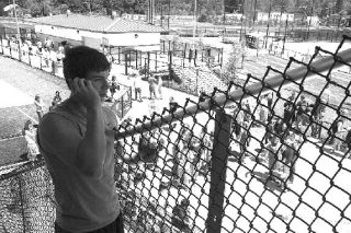 Calling his father from the stadium bleachers