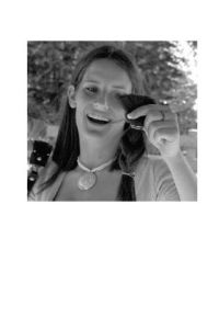 Taylor Robbins takes a look at her braided hair donation. Participants were all smiles as they waited to be clipped.