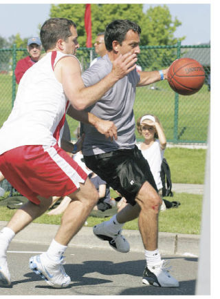 Warren Moon of Carnation works toward the basket against Ken Roorda of Issaquah